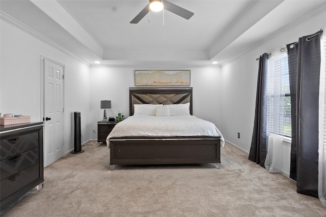 13206 Blass Ct, Houston, TX 77044 - bedroom with a tray ceiling, light carpet, a ceiling fan, and ornamental molding