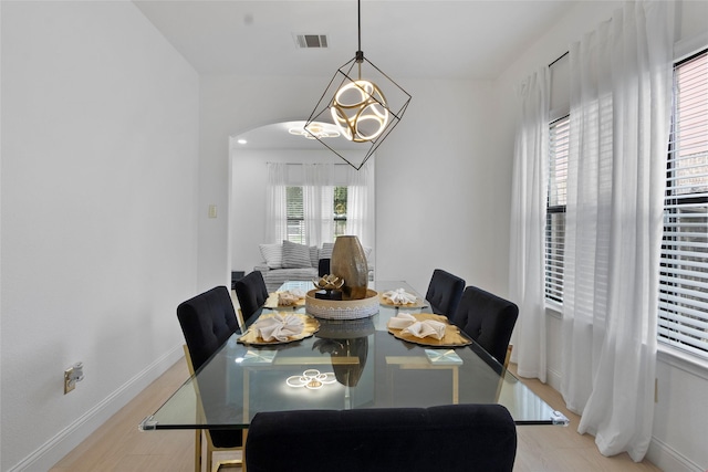 13206 Blass Ct, Houston, TX 77044 - dining space with a chandelier and light wood-style flooring