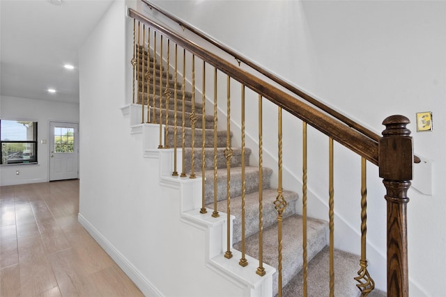 13206 Blass Ct, Houston, TX 77044 - stairway with recessed lighting and wood finished floors
