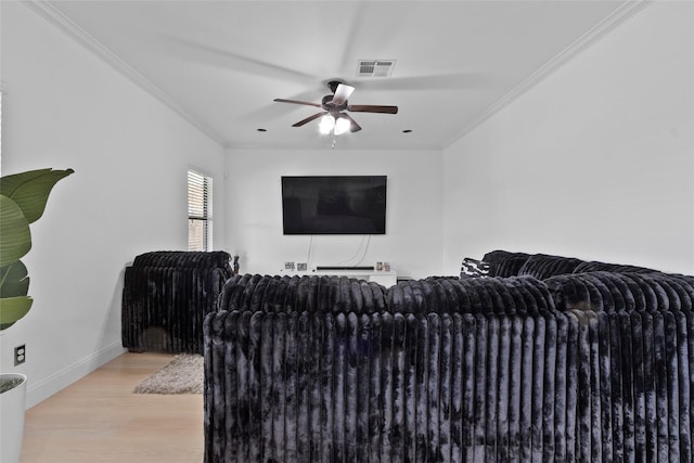 13206 Blass Ct, Houston, TX 77044 - living area with a ceiling fan, crown molding, and wood finished floors