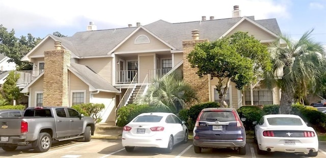 2300 Old Spanish Trl Unit 2116, Houston, TX 77054 - view of front of house with stairs, uncovered parking, and brick siding
