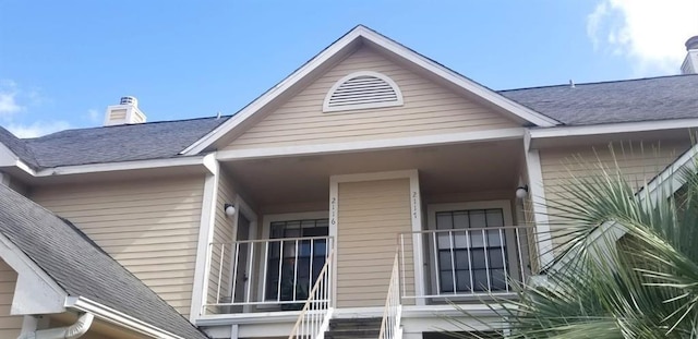 2300 Old Spanish Trl Unit 2116, Houston, TX 77054 - view of home's exterior with roof with shingles and a chimney