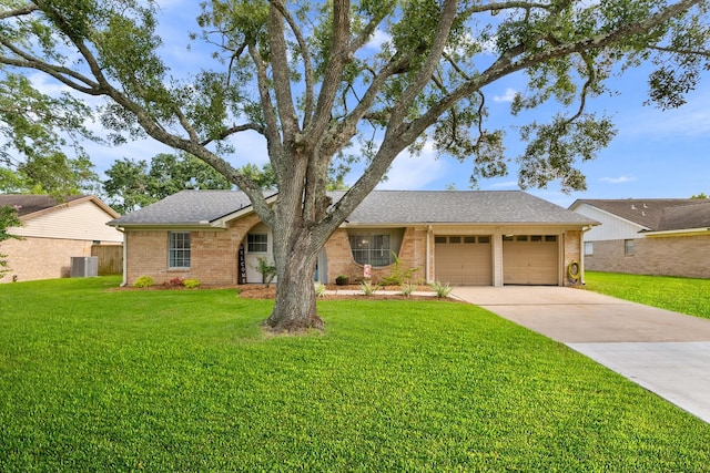 2605 Perry Ln, Alvin, TX 77511 - single story home with concrete driveway, a garage, roof with shingles, a front lawn, and brick siding