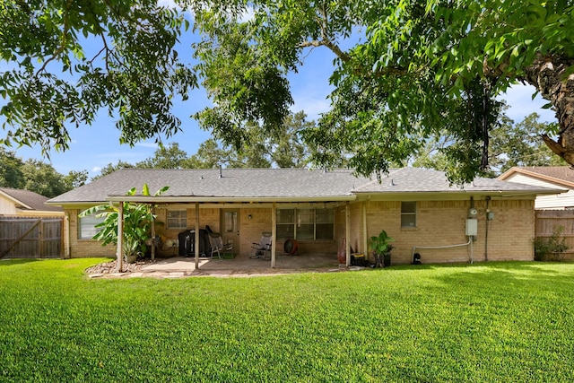 2605 Perry Ln, Alvin, TX 77511 - rear view of house featuring a patio area, brick siding, and a shingled roof