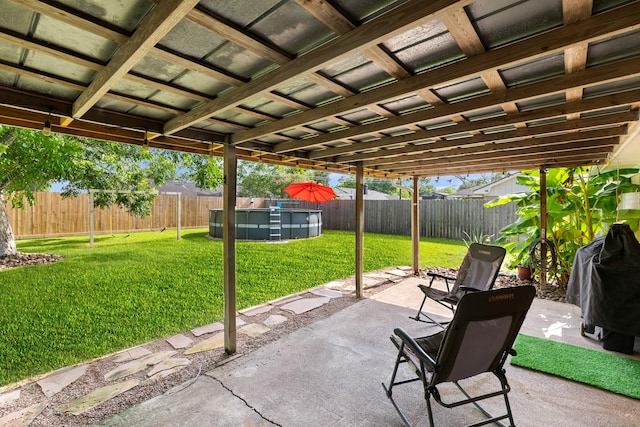 2605 Perry Ln, Alvin, TX 77511 - fenced backyard featuring a patio area and grilling area