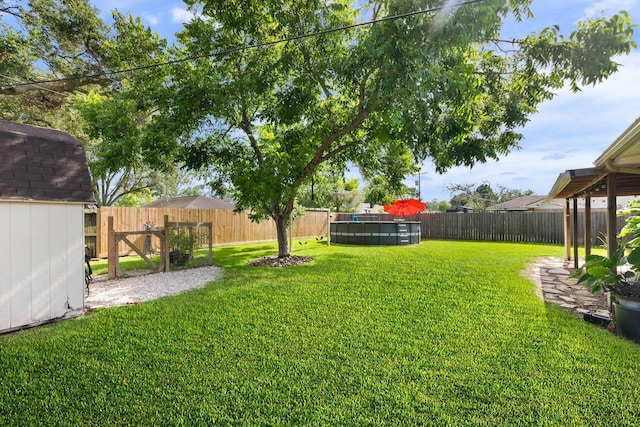 2605 Perry Ln, Alvin, TX 77511 - fenced backyard with a shed
