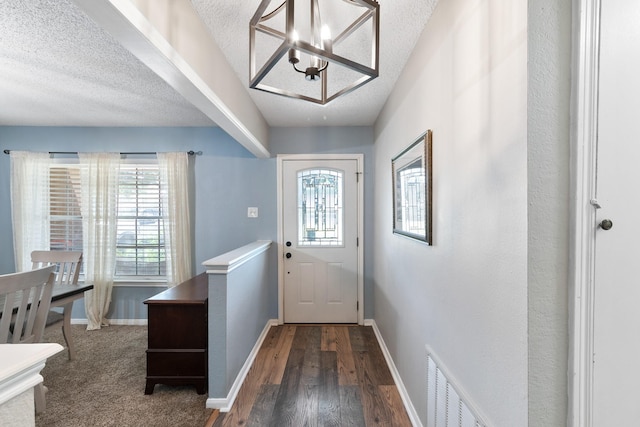 2605 Perry Ln, Alvin, TX 77511 - doorway with a chandelier, a textured ceiling, plenty of natural light, and wood finished floors