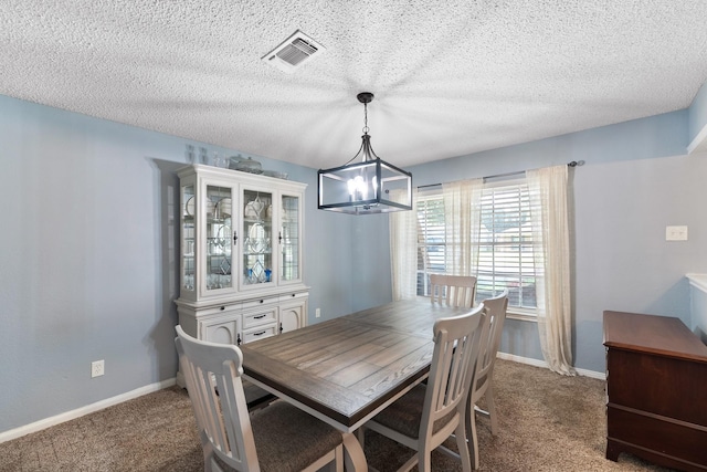 2605 Perry Ln, Alvin, TX 77511 - carpeted dining area with a textured ceiling and baseboards