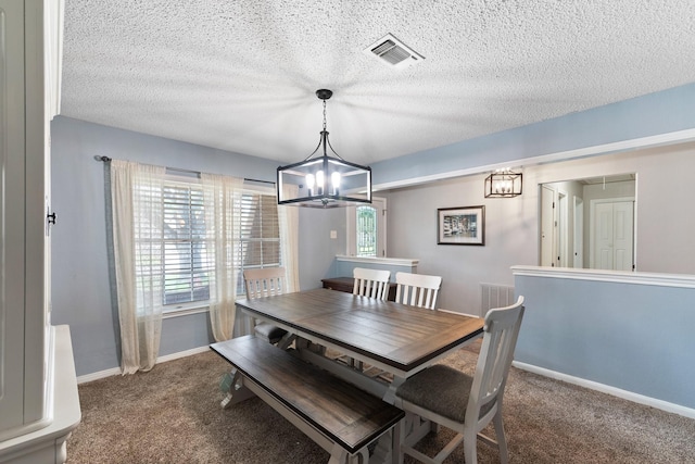 2605 Perry Ln, Alvin, TX 77511 - dining room featuring a chandelier, carpet floors, and a textured ceiling