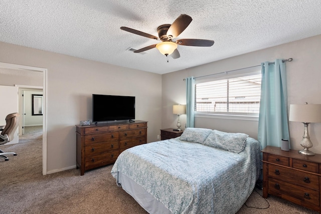 2605 Perry Ln, Alvin, TX 77511 - bedroom with carpet flooring, a textured ceiling, and a ceiling fan