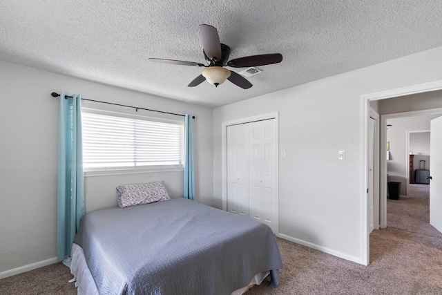2605 Perry Ln, Alvin, TX 77511 - carpeted bedroom with a ceiling fan, a closet, and a textured ceiling