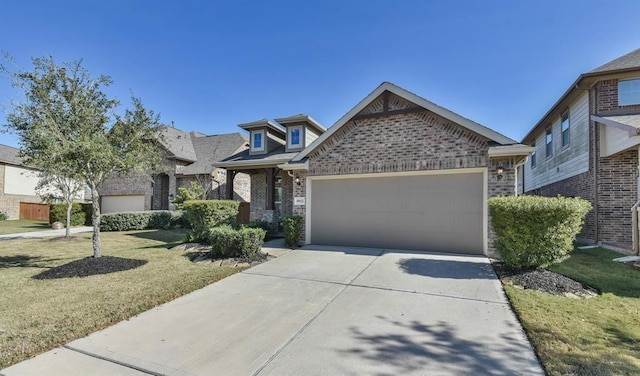 8922 Pinenut Dr, Cypress, TX 77433 - view of front of property featuring an attached garage, brick siding, driveway, and a front yard