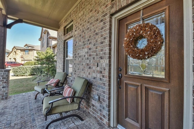 8922 Pinenut Dr, Cypress, TX 77433 - doorway to property featuring brick siding