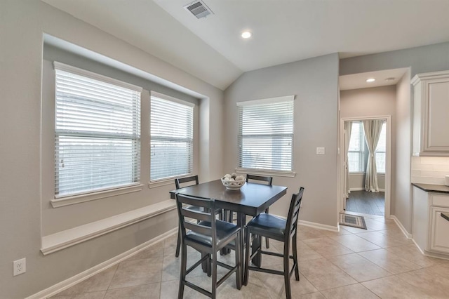 8922 Pinenut Dr, Cypress, TX 77433 - dining space featuring light tile patterned floors, recessed lighting, and lofted ceiling