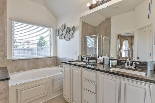 8922 Pinenut Dr, Cypress, TX 77433 - full bath with lofted ceiling, a shower stall, a garden tub, and double vanity
