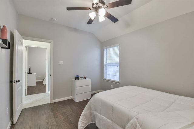 8922 Pinenut Dr, Cypress, TX 77433 - bedroom with wood finished floors, vaulted ceiling, and a ceiling fan