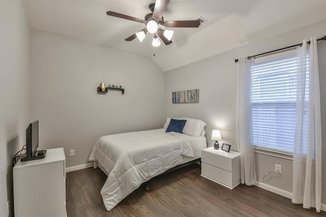 8922 Pinenut Dr, Cypress, TX 77433 - bedroom featuring vaulted ceiling, dark wood-style flooring, and a ceiling fan