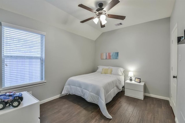 8922 Pinenut Dr, Cypress, TX 77433 - bedroom featuring multiple windows, dark wood-type flooring, ceiling fan, and vaulted ceiling