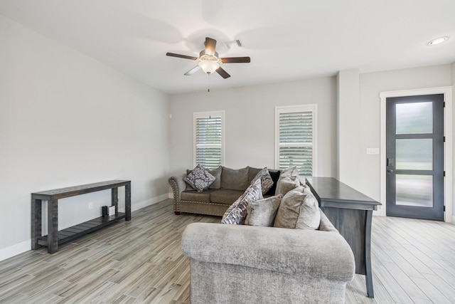 16726 Echo Heights Dr, Cypress, TX 77433 - living room with light wood-style floors and ceiling fan