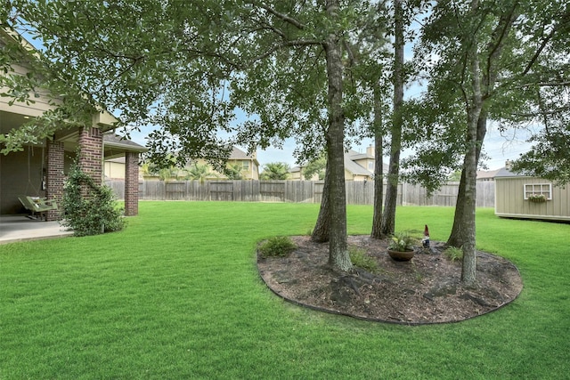 23706 Tristan Bay Ct, Spring, TX 77386 - fenced backyard with a patio and a storage unit