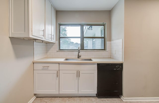4921 Michael Dr, Houston, TX 77017 - kitchen featuring black dishwasher, backsplash, white cabinets, and light countertops