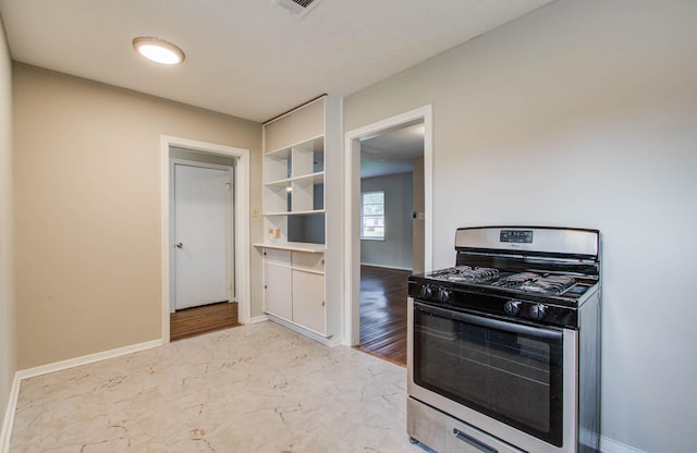 4921 Michael Dr, Houston, TX 77017 - kitchen featuring stainless steel gas range and baseboards