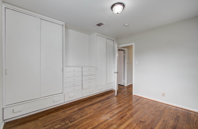 4921 Michael Dr, Houston, TX 77017 - unfurnished bedroom with wood finished floors and multiple closets