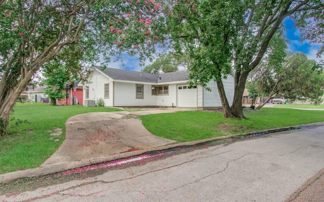 4921 Michael Dr, Houston, TX 77017 - ranch-style home featuring a garage, concrete driveway, and a front lawn