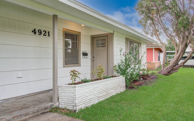 4921 Michael Dr, Houston, TX 77017 - view of exterior entry featuring a lawn and covered porch