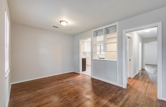 4921 Michael Dr, Houston, TX 77017 - spare room with dark wood-type flooring and baseboards