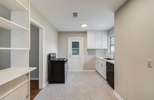 4921 Michael Dr, Houston, TX 77017 - kitchen with range with gas cooktop, black dishwasher, light countertops, light marble finish flooring, and white cabinetry