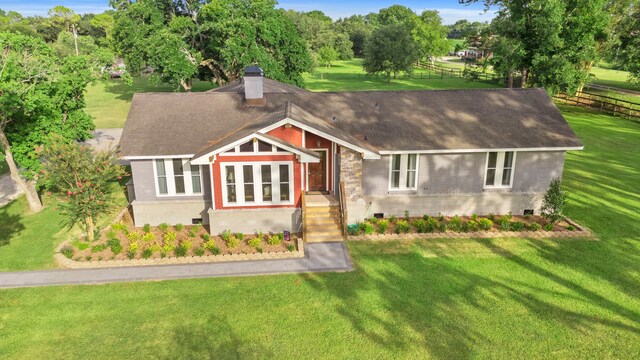 3211 County Road 237, Alvin, TX 77511 - view of front facade with brick siding, a chimney, roof with shingles, and crawl space
