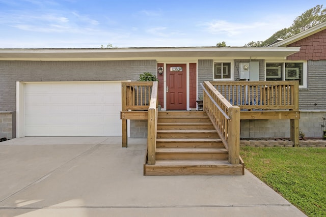 3211 County Road 237, Alvin, TX 77511 - view of front of property featuring an attached garage, concrete driveway, a porch, and brick siding