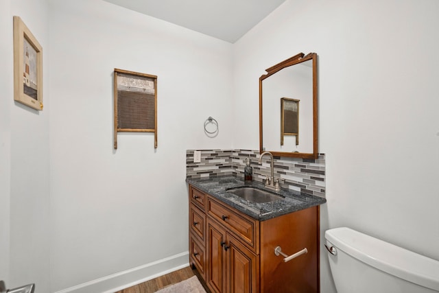 3211 County Road 237, Alvin, TX 77511 - bathroom with wood finished floors, vanity, and backsplash