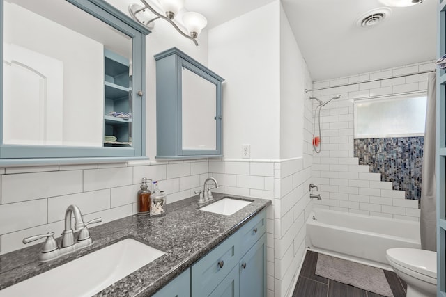 3211 County Road 237, Alvin, TX 77511 - bathroom with tile walls, double vanity, and shower / tub combo