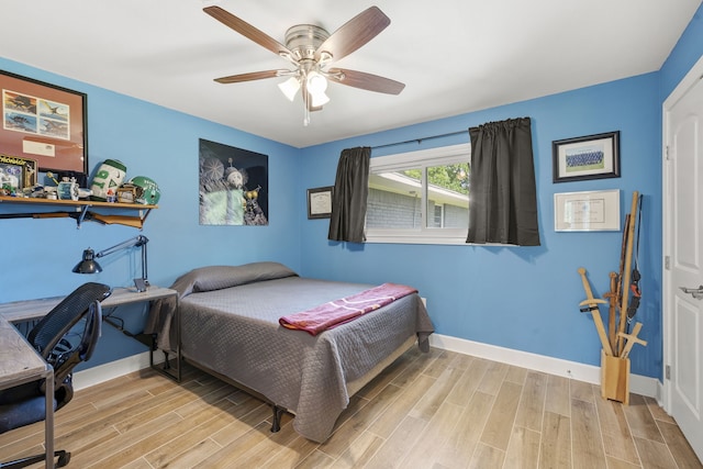 3211 County Road 237, Alvin, TX 77511 - bedroom featuring light wood-type flooring and a ceiling fan