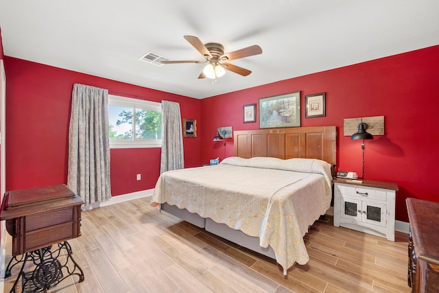 3211 County Road 237, Alvin, TX 77511 - bedroom featuring light wood-type flooring and a ceiling fan
