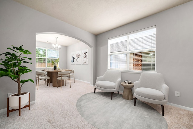 15515 Hinsdale Springs Ln, Houston, TX 77053 - living area featuring carpet floors, arched walkways, and a chandelier