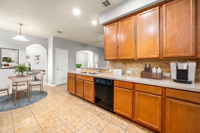 15515 Hinsdale Springs Ln, Houston, TX 77053 - kitchen with dishwasher, arched walkways, light countertops, and recessed lighting
