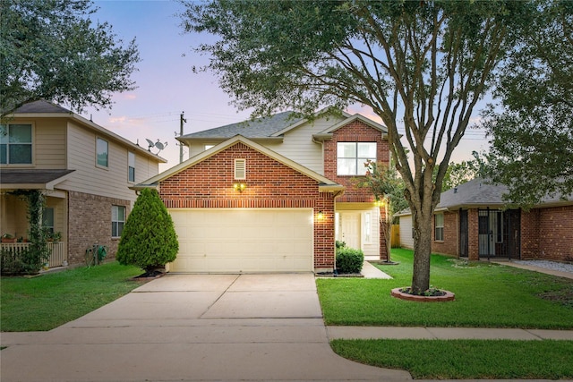 15515 Hinsdale Springs Ln, Houston, TX 77053 - traditional-style house with concrete driveway, a garage, brick siding, and a yard