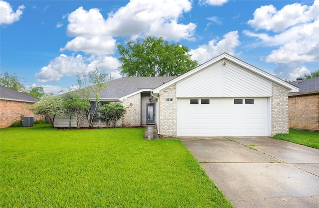 15111 Silverman St, Houston, TX 77598 - view of front facade with brick siding, a front lawn, and driveway