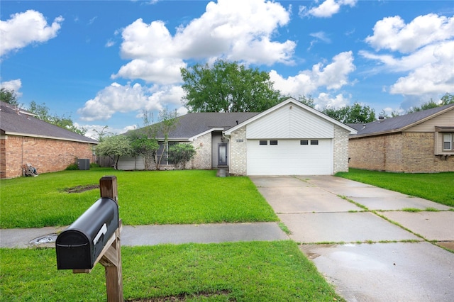 15111 Silverman St, Houston, TX 77598 - view of front of home featuring driveway, an attached garage, brick siding, and a front yard