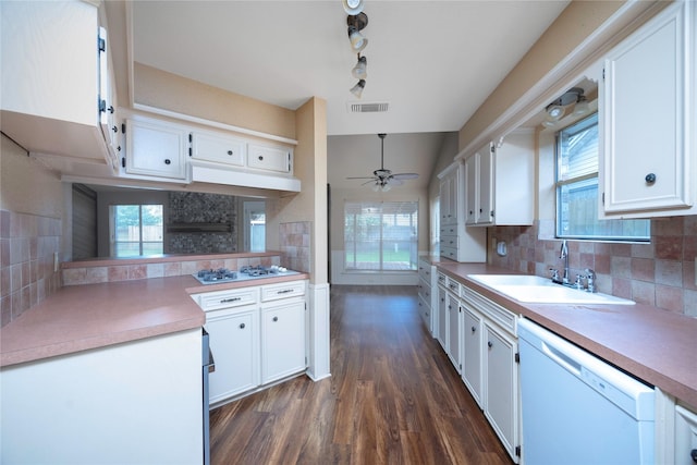 15111 Silverman St, Houston, TX 77598 - kitchen featuring white appliances, white cabinets, a ceiling fan, dark wood-type flooring, and tasteful backsplash
