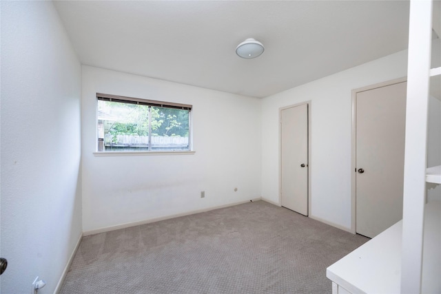 15111 Silverman St, Houston, TX 77598 - unfurnished bedroom featuring light colored carpet and baseboards