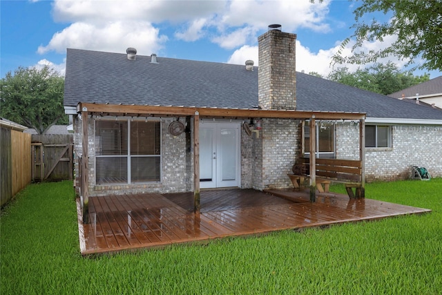 15111 Silverman St, Houston, TX 77598 - back of property with a chimney, a shingled roof, a wooden deck, and brick siding