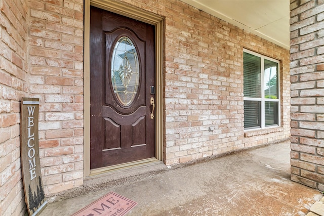 3302 Candlelon Dr, Spring, TX 77388 - view of exterior entry featuring brick siding and a porch