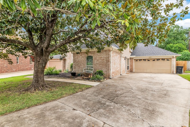 3302 Candlelon Dr, Spring, TX 77388 - view of front of house with brick siding, concrete driveway, an attached garage, and roof with shingles