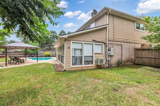 3302 Candlelon Dr, Spring, TX 77388 - rear view of house featuring a gazebo, a chimney, a patio area, and a fenced backyard