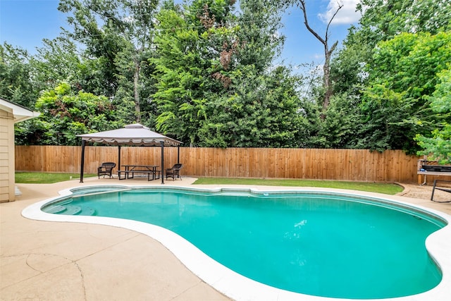 3302 Candlelon Dr, Spring, TX 77388 - view of swimming pool with a patio area, a fenced backyard, view of wooded area, and a gazebo