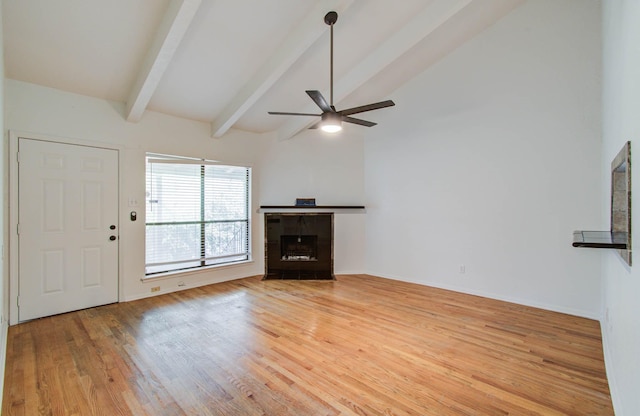 5711 Sugar Hill Dr Unit 108, Houston, TX 77057 - unfurnished living room with a ceiling fan, light wood finished floors, and a tiled fireplace